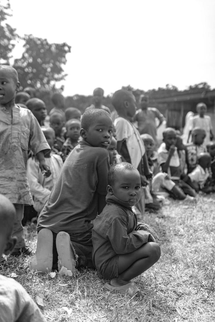 Children Sitting on Grass